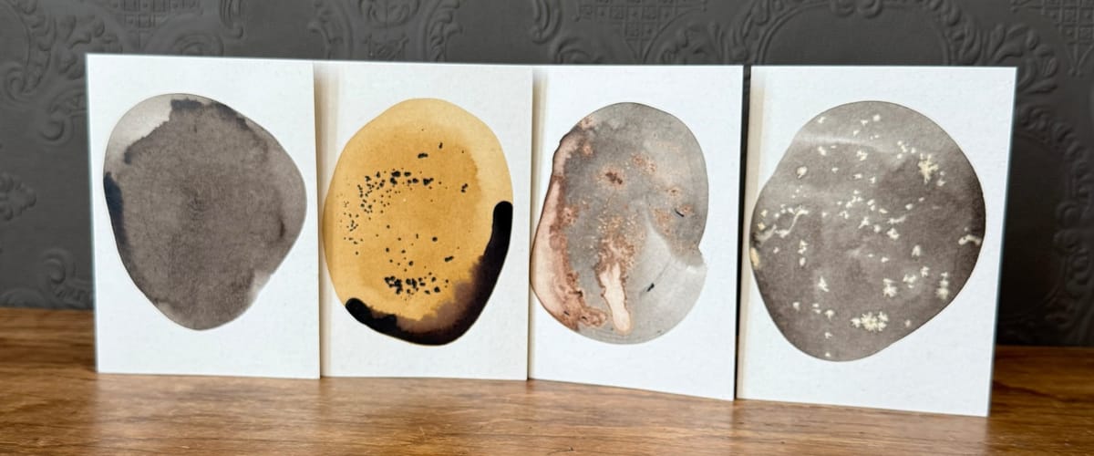 Four greeting cards with coloured ink blobs